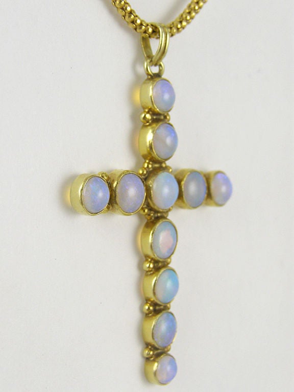 14K yellow gold bezel set opal cross,  2 1/4