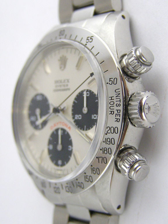 Rolex SS Daytona ref 6265 serial # 9.1 million circa 1984 in magnificent condition complete with box and warrantee papers and recent Rolex service certificate. This pristine example features the original mint condition silver satin dial with black