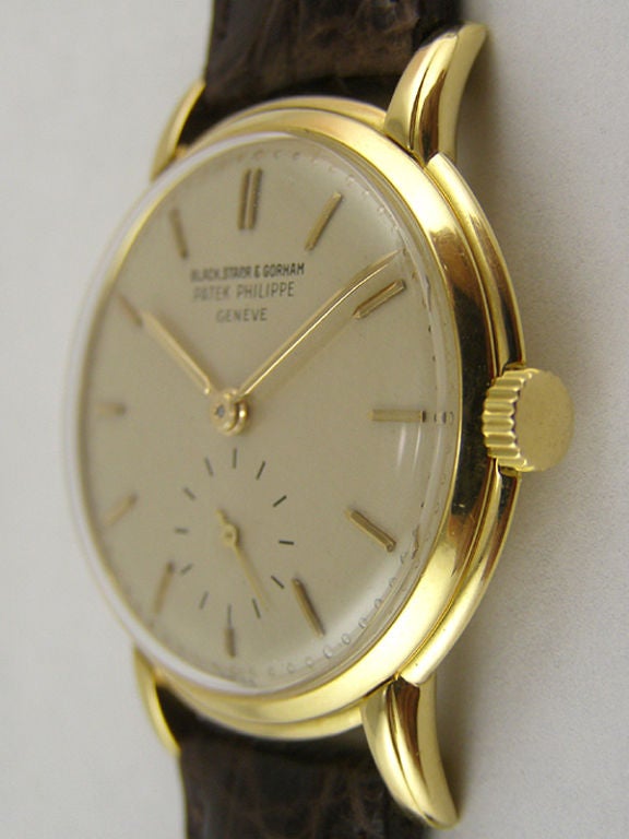 Patek Philippe 18K YG ref #2484 31 x 34 medium sized case with stepped bezel and lugs. Very pleasing original matte silver dial with gold applied indexes small silvered 