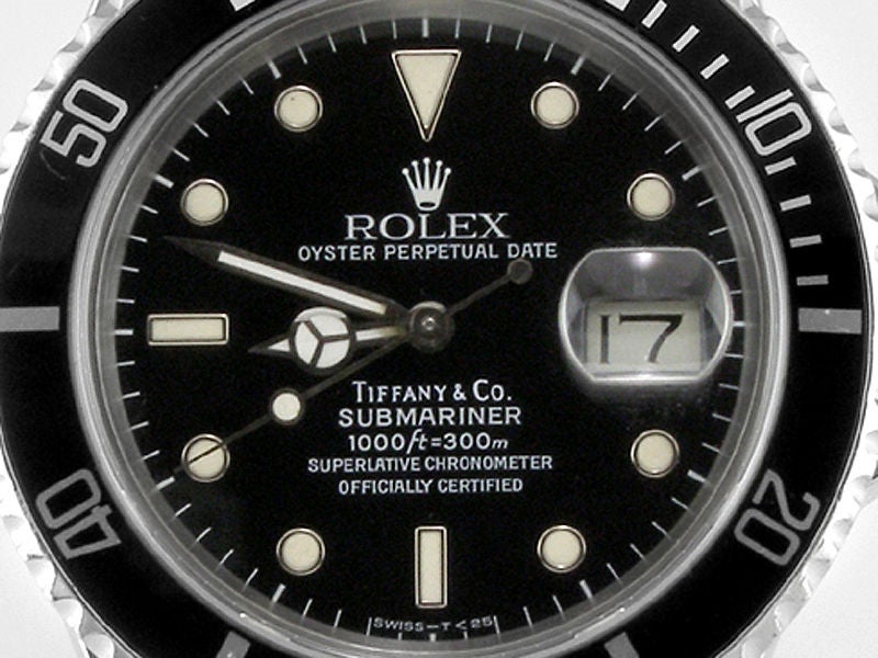 Rolex SS Submariner with date ref 16800 transitional model with date retailed by Tiffany & Co. 40mm diameter case circa 1986 original glossy black dial with white gold luminous surrounds signed Tiffany & Co. Calibre 3035 self winding movement with