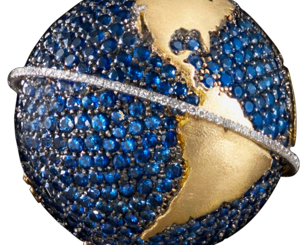 18k yellow and white gold, Blue Sapphire Pave’ (14 cts.) Pendant surrounded by a Diamond Pave’ Equator and suspended in an armillary of Diamond Pave’ (4 cts) to allow 360 degree rotation