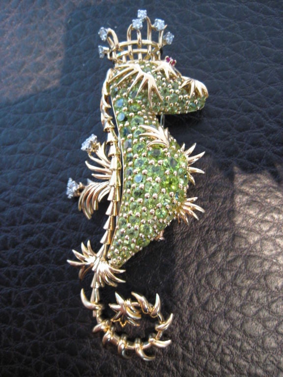 Wonderful Seahorse by Jean Schlumberger for Tiffany and Co. set with Peridot and Diamonds with ruby eyes in 18 karat yellow gold.