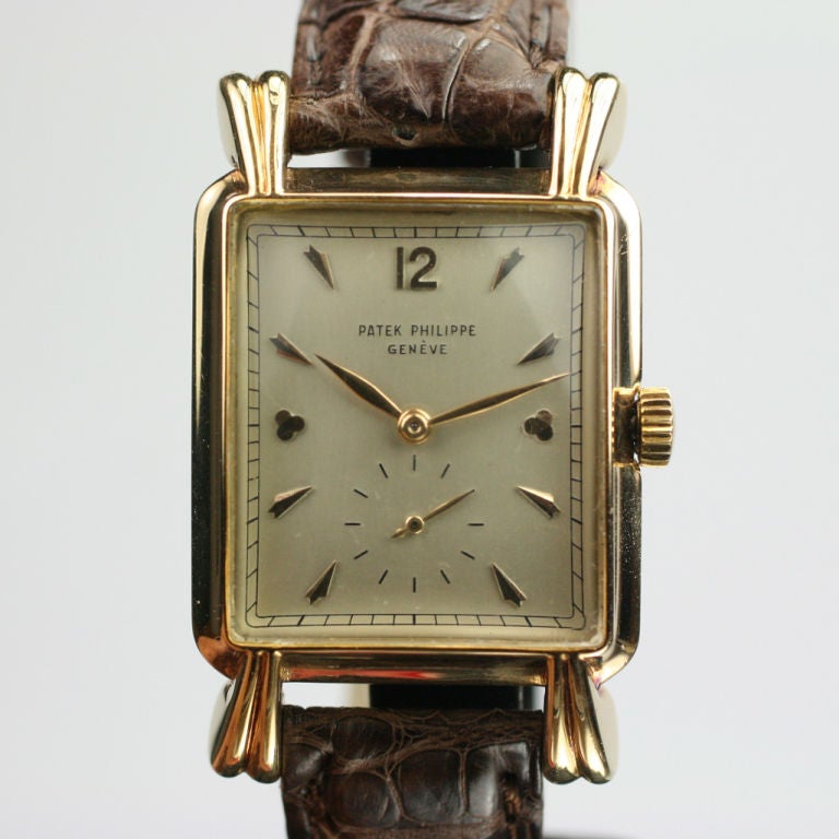 This is a beautiful example of a vintage Patek Philippe with unique faceted markers, and fancy ridged and curled tear drop lugs. Production of this watch began in 1948. This watch comes with an extract from the Patek archives dating the watch to