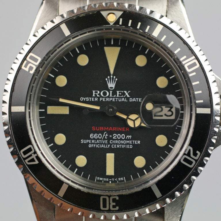 This is a great example of a Rolex Submariner Date that is quite rare in that it is complete Red Submariner 1680 with double box, guaranty, booklets, anchor,hangtag and extra link. The booklets and certificate have all been stamped by the retailer,