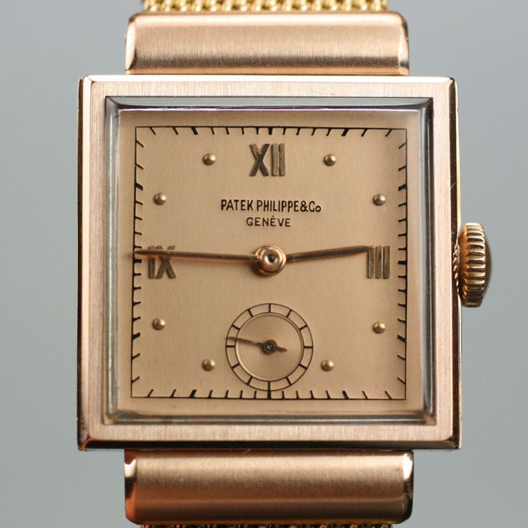 A beautiful patek Philippe square dress watch from the late 1940s. This manual wind watch comes on a beautiful 18K rose gold mesh band.  An extract from the Patek archives accompanies the watch.