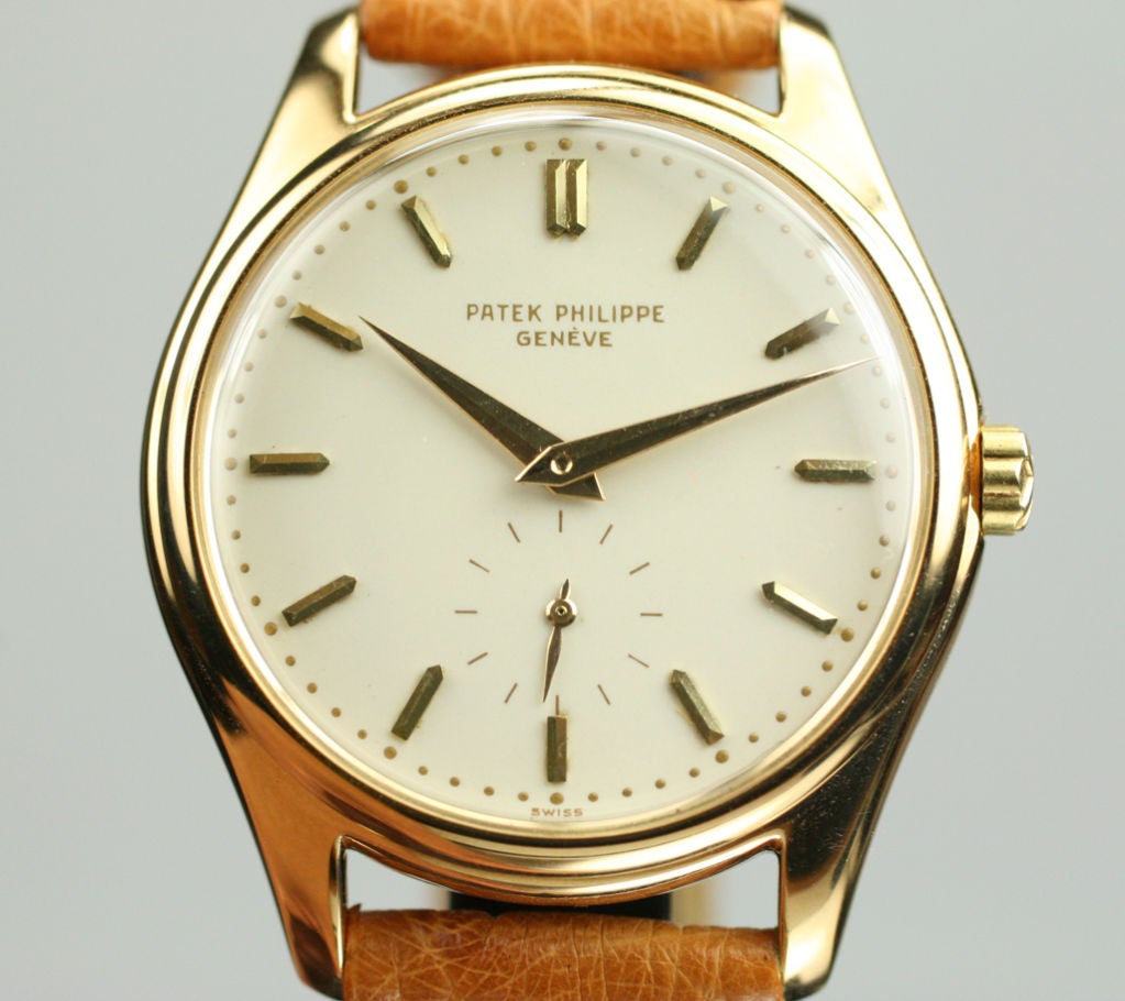 The Patek Philippe reference 2526 is very collectible because of its porcelain dial.  This example is in excellent condition, with gilt writing and applied yellow gold stick markers, gold dauphine hands, and subsidiary seconds dial.  The watch comes