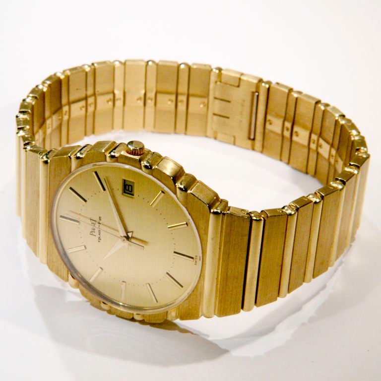 18k yellow gold heavy Piaget Polo bracelet watch with date. Quartz movement.  Signed Tiffany & Co. Stamped with inventory #15661C701, 368193.