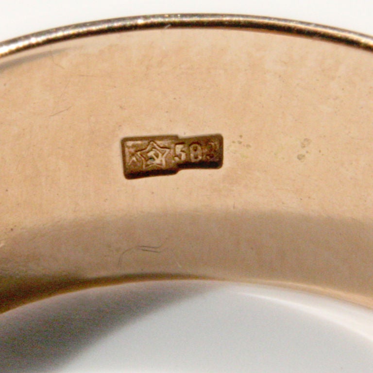 Rare Russian 14 karat pink gold wedding band in a rounded shape.  Hallmarked with a hammer and sickle within a Russian star and the numerical gold fineness as 583, which is the Russian Standard of 14K gold.  This is the earlier star core image which