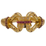 Gold bracelet set with rubies and diamonds by Cartier London
