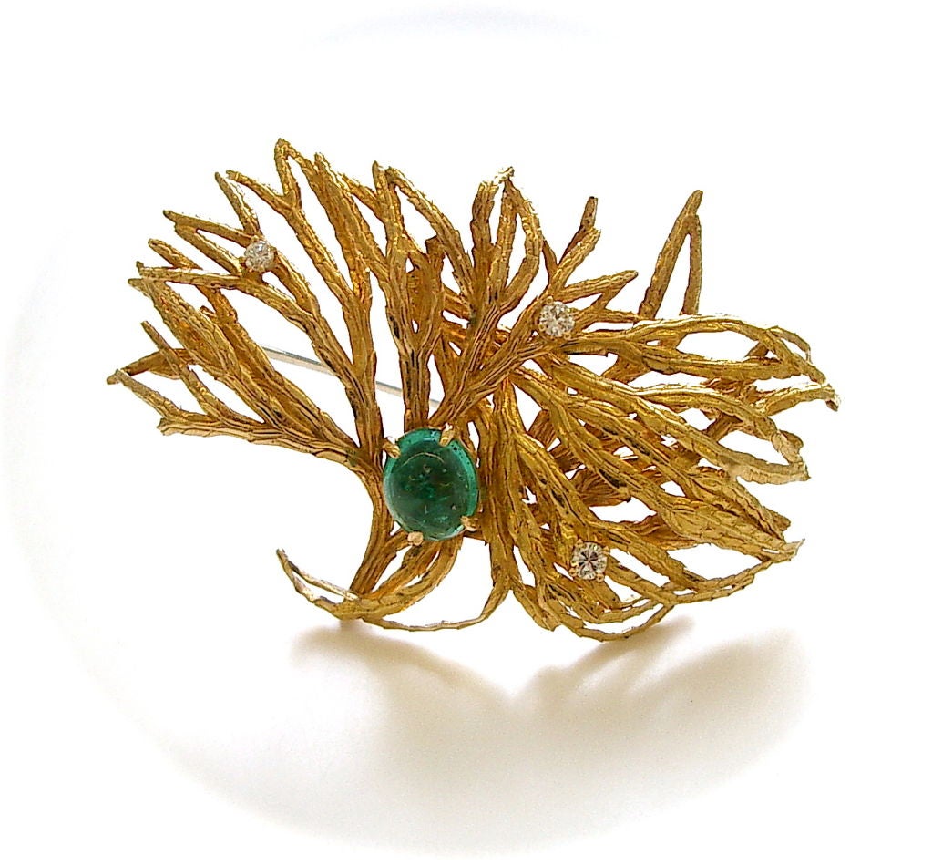 An elegant suite of 18k yellow gold diamond and emerald jewelry by Marianne Ostier. The brooch with textured 