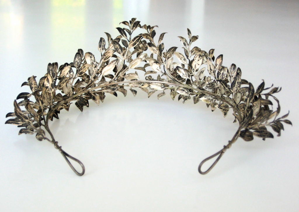 A pretty 19th century tiara. The silver handcrafted leaves and flowers with a natural patina throughout the crown. The 