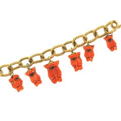Coral Carved Faces Charm Bracelet