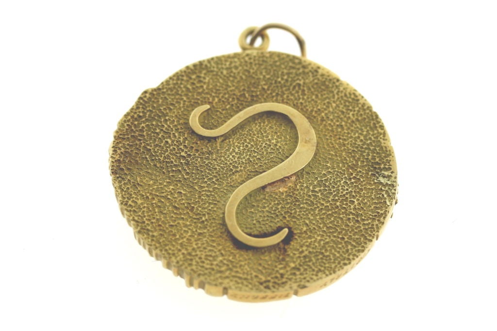 18k textured gold Leo zodiac medallion with five diamonds, 1.75