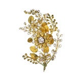 An antique pink topaz and gold brooch