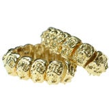 A pair of 18kt gold bracelets, David Webb