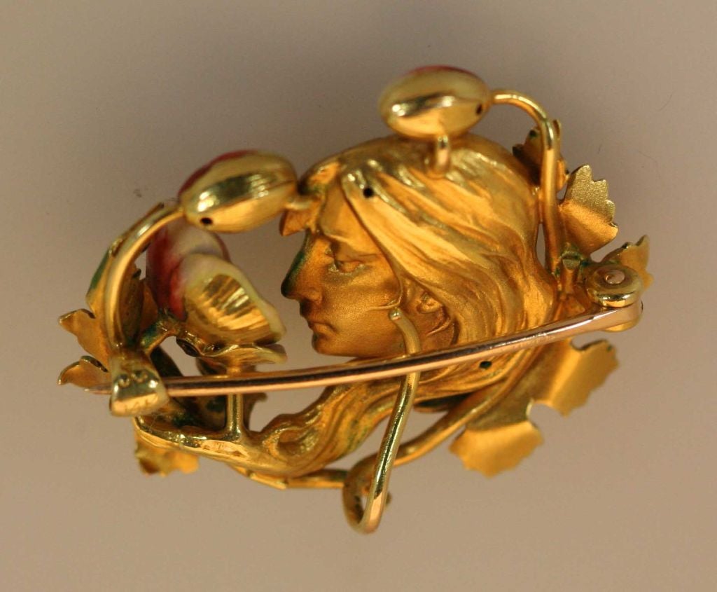 American Art Nouveau brooch by Krementz & Co. circa 1900-1910. The brooch is 14kt gold with enamel and set with single diamond. It measures 1 3/8
