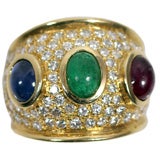 Three stone diamond ring with cabochon ruby, emerald
sapphire Three stone diamond ring with cabochon ruby, emerald
sapphire
