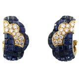 Serti Mysterieux Sapphire earclips by Van Cleef 
Arpels