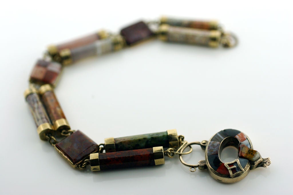 Low carat yellow gold with Multi-Colored Scottish Agate, Gate Clasp. Circa 1870's.<br />
Bracelet is 8 inches in length