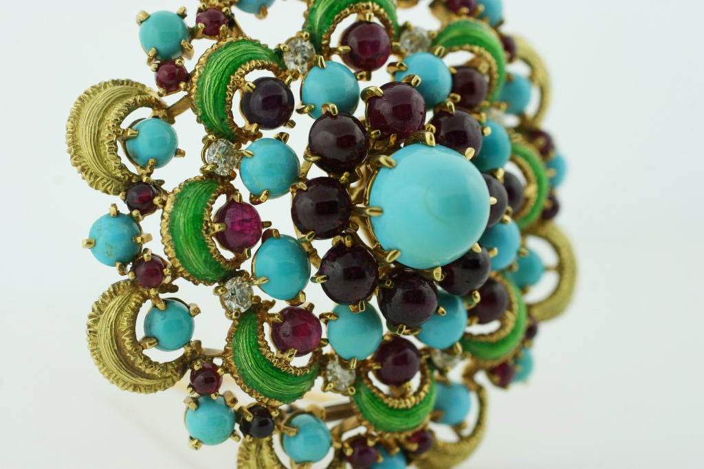 Handmade Brooch from the 1950's. Set with 8 Diamonds among turquoise stones and rubies in 18k Yellow Gold and Enamel.