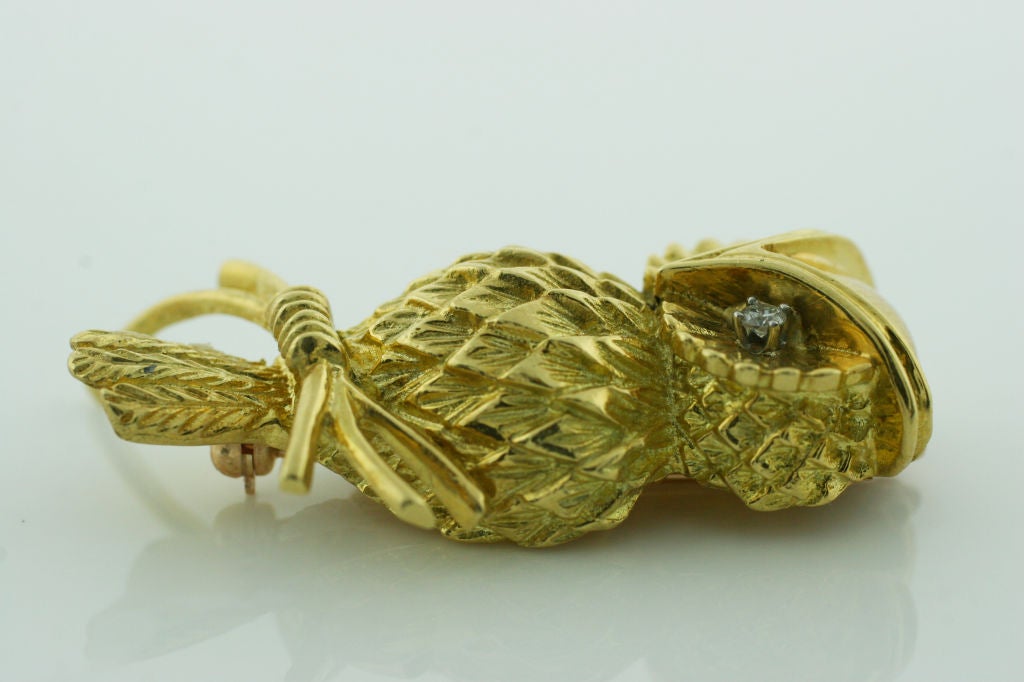 This is a 18K Yellow Gold Broach made in the appearance of an owl, with Diamond eyes. It is Vintage Tiffany & Co.