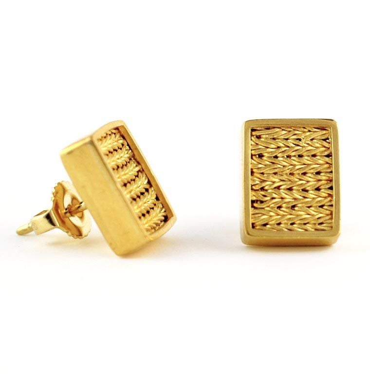 Blending the ancient art of weaving gold with a modern bezel, this handsome pair of gold earrings are great for everyday wear.   

Designed and made in-house by Julius Cohen New York.