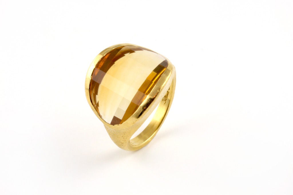 22kt gold and saddle cut citrine ring.  The unique cut of the citirine, called a saddle cut, gives this ring a modern look.  Designed and made in-house by Julius Cohen New York.