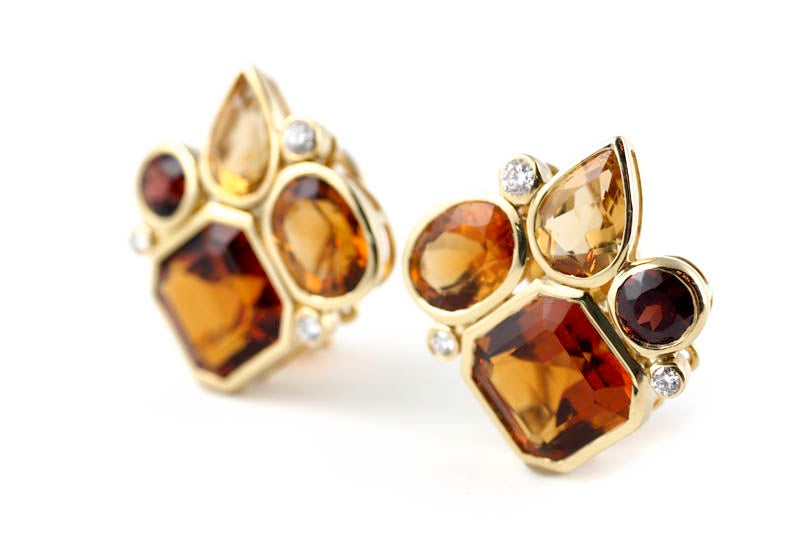 Playful and sophisticated amber colored earrings. These earrings are part of a collection inspired by the whimsical shapes and colors in a kaleidoscope. The open 18kt gold bezel settings in these earrings allow the stones' clarity and color to shine