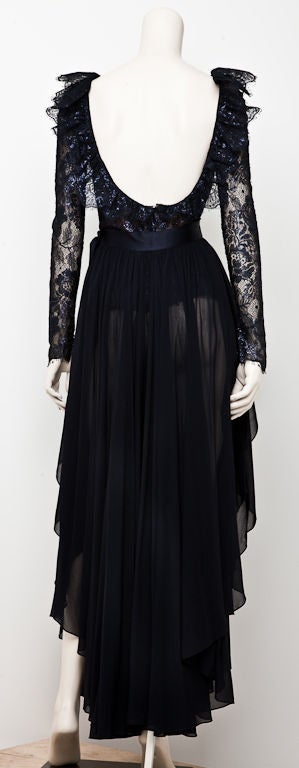 Midnight blue Lace and chiffon evening ensemble designed by Carolyn Roehm. Top has a bit of lurex creating a subtle glitter with a sexy bare back and ruffle detail running along neckline shoulder, and back. The flowing chiffon skirt is a culotte