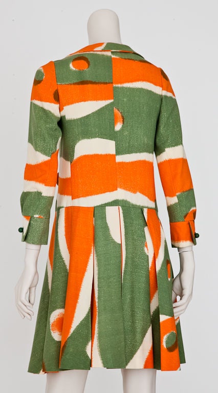 Emanuel Ungaro Parallelle green + orange graphic print wool dropped  waist day dress  with box pleated skirt and front flap pocket detail. C. 1968. Zipper closure is hidden by placket front.