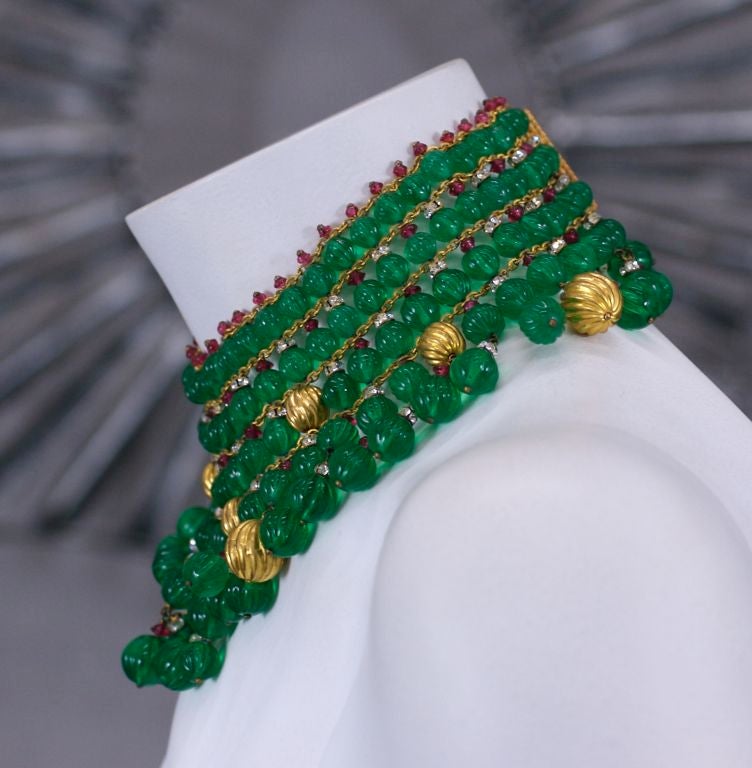 Important pate de verre collar by Maison Gripoix for Chanel. The bib is completely hand made of emerald poured glass fluted beads which are arranged with ruby and pave spacers as well as gold leafed fluted beads. An important collectors piece.
