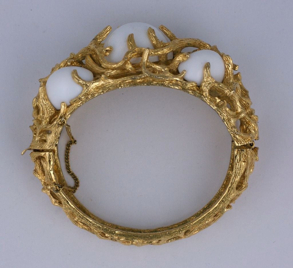 Panetta gilt cuff with faux white coral cabochons. Hinged side closure. <br />
2.25