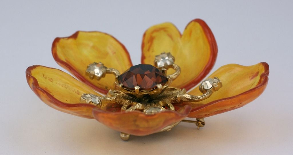 Castlecliff Lucite Petal and paste flower brooch. Amber lucite curled  petals (dated 1967) with clear and dark citrine pastes. <br />
3.5