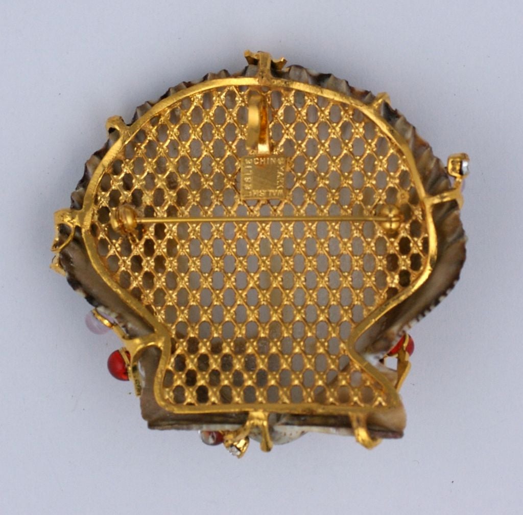 Striated Scallop brooch with gilt seaweed with pale rose and ruby poured glass cabochons. Can also be worn as pendant.<br />
2.5