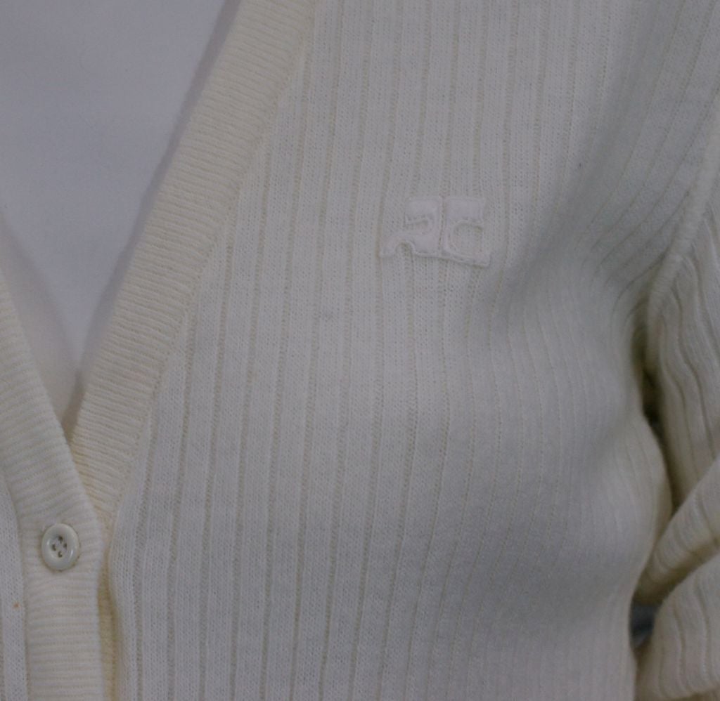 Courreges cream ribbed cardigan 80/20% acrylic/nylon blend.<br />
