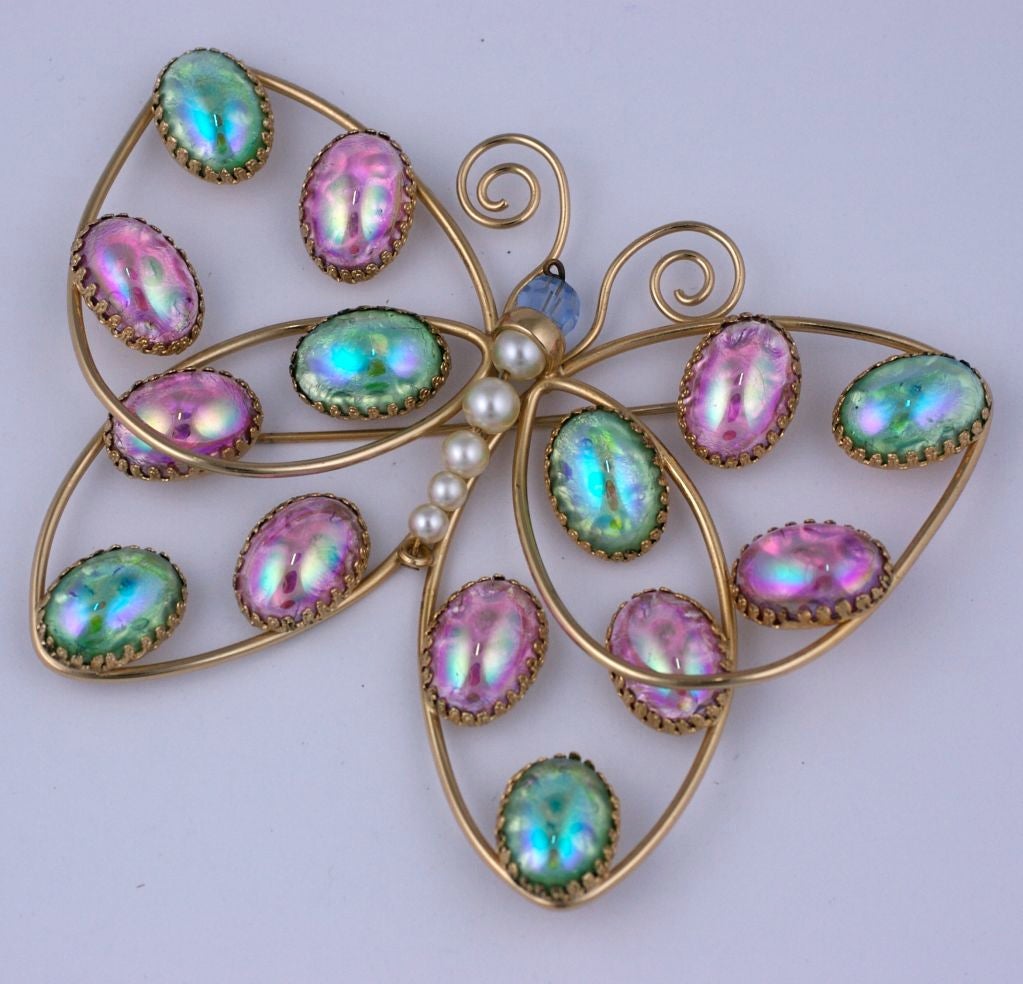 Pair of massive Napier butterfly brooches with cabochon aurora pink and blue green austrian stones. Matte gold finish with faux pearl body circa 1950s.
Excellent condition. 
Sold singly or as a pair, $650 each.
4.5