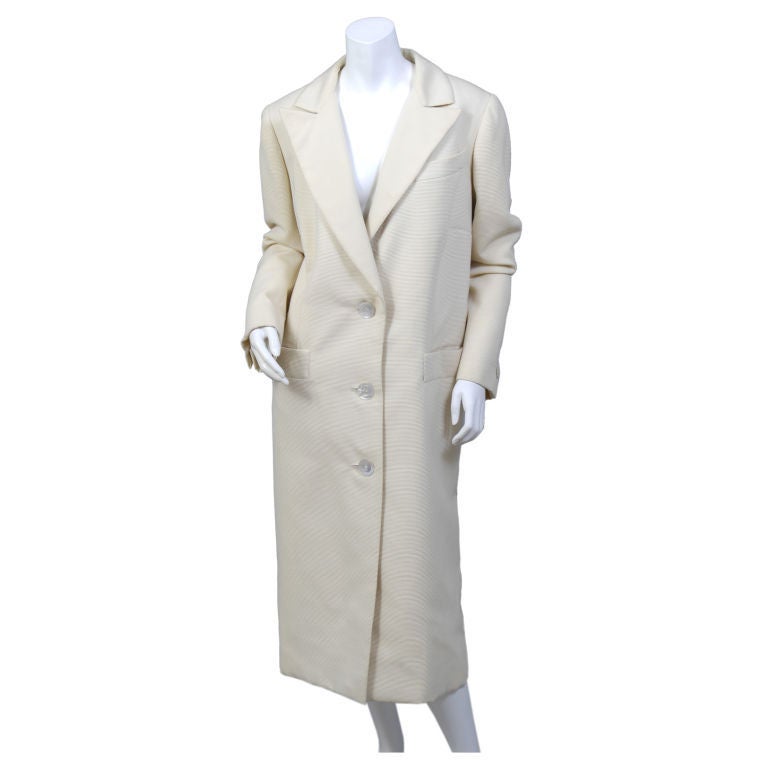 A classic couture coat in a truly wearable size, this coat is from the closet of a celebrated New Yorker who was a member of the International Best Dressed List. That is a club we would all like to join, and this silk faille coat will get you on