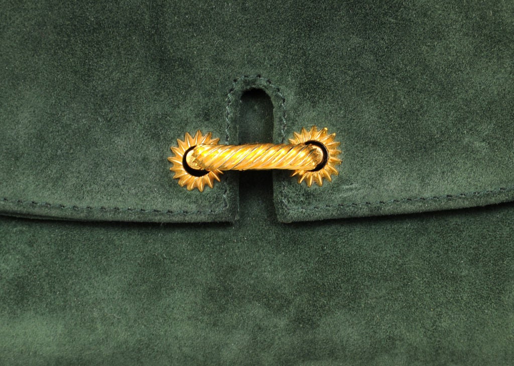 Vintage Gucci in a gorgeous shade of green suede, this is a fabulous clutch or shoulder bag from the 1970's.  It just feels wonderful in your hand!<br />
<br />
Soft, supple green suede, this bag works as a neutral with so many other colors from