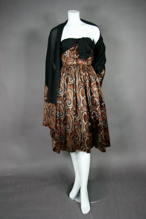 Strapless printed silk paisley devoré velvet cocktail dress, silk chiffon trim on bust with folded drop bow. Matching fabric shawl with silk chiffon. 

SHAWL MEASUREMENTS
Length - 76.5