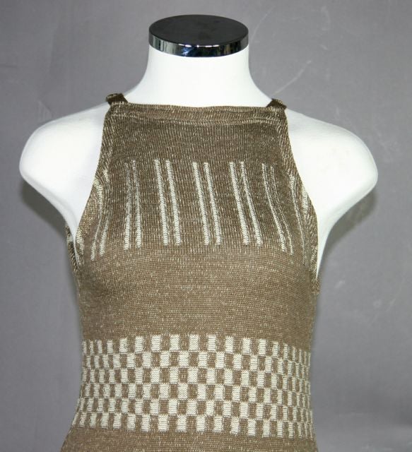 Rudi Gernreich. Check, stripes and specks. Brown and white. Side slits at hem and peek-a-boo holes on hips. Bib-cut at shoulders. Please note: measurements are unstretched. Dress has give. 
