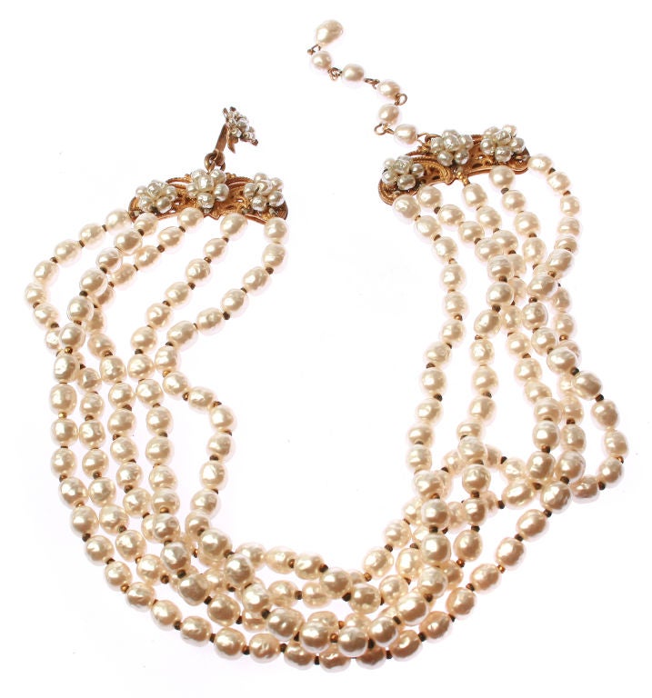This is a very wearable and pretty Miriaim Haskell Necklace,consisting of 5 strands of baroque pearls with gold metal spacers between each bead