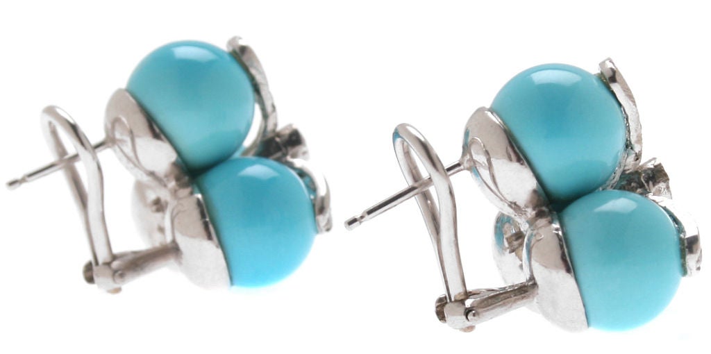 These great looking earrings have omega backs and are very comfortable.  The diamonds accent the Persian turquoise nicely.