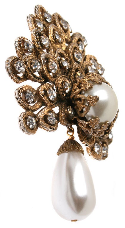 This is a gorgeous and early brooch by Chanel.  It can also be worn as a pendant.