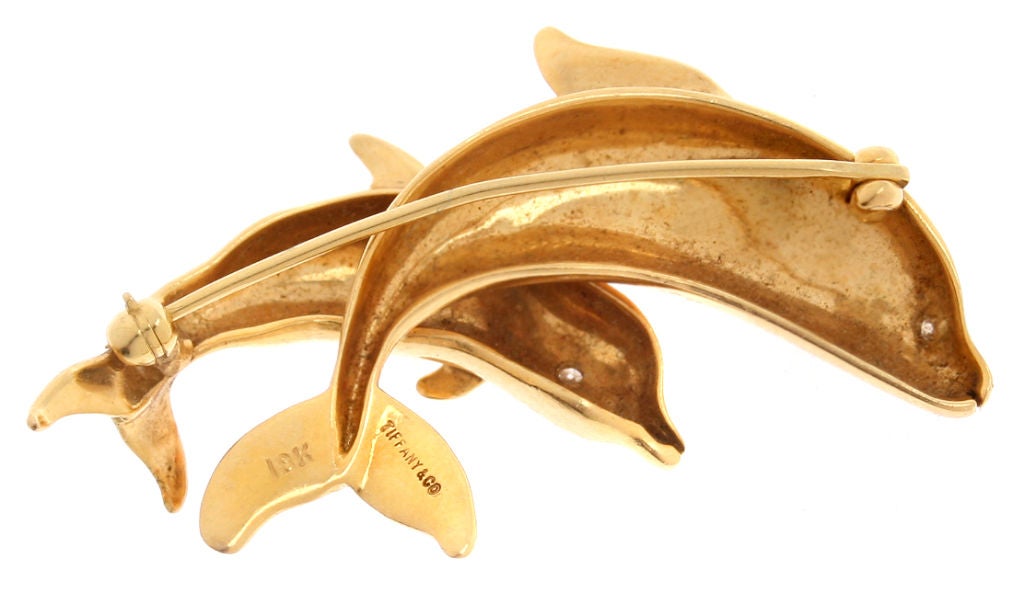 This pair of Dolphin are accented with diamond eyes.