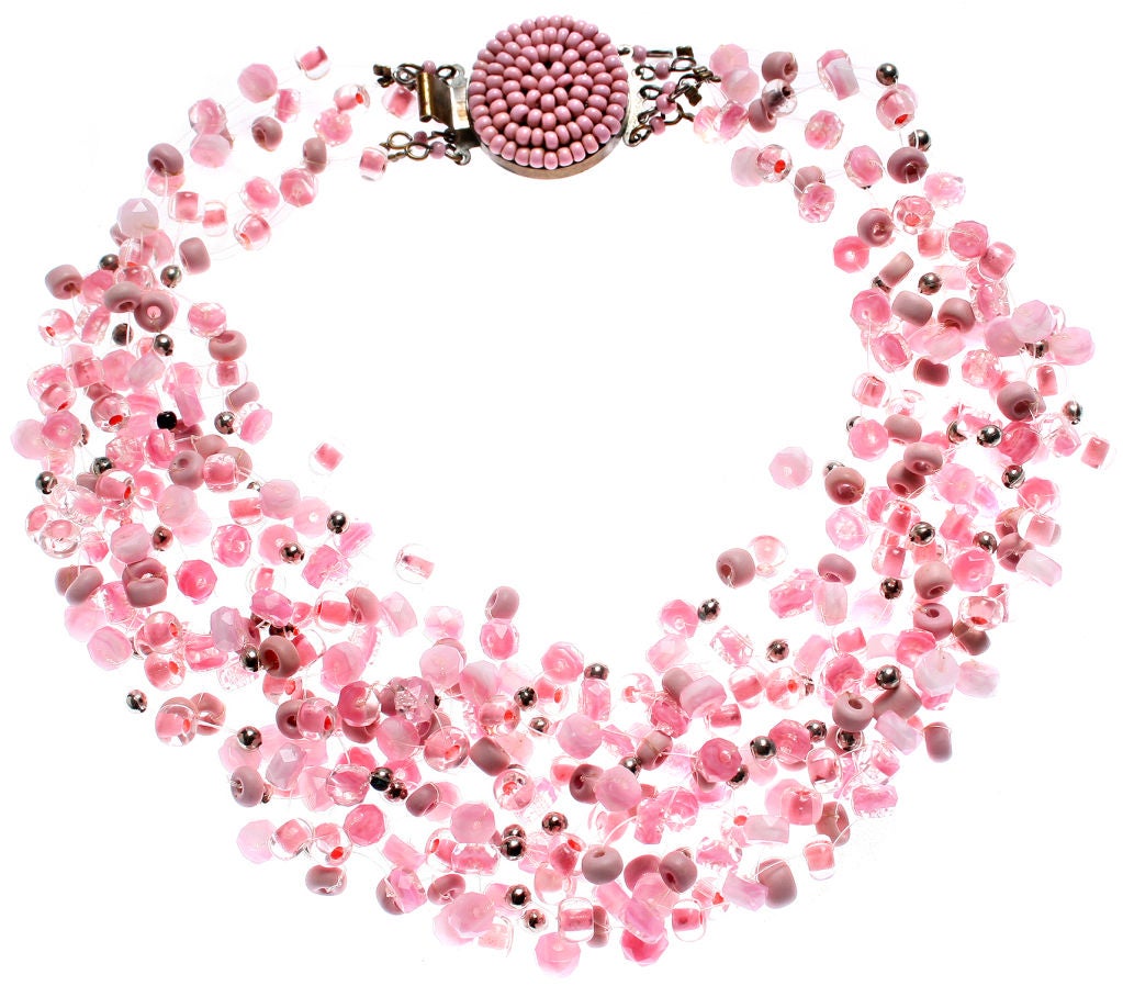 This is a very pretty and wearable Langani necklace and earring set.  There is nice variation in the pink color as well as in the shape of the beads. The necklace measures approximately 15 inches in length and  approximately 2.25 inches wide when