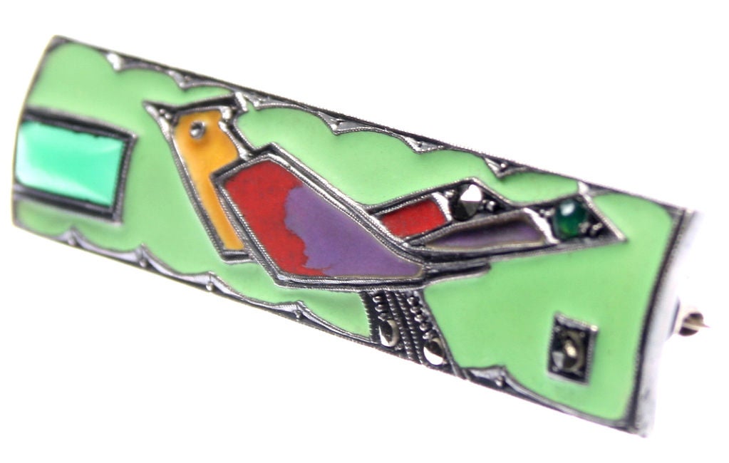 This is a wonderful Art Deco Brooch.  It is enameled on sterling with accents of marcasite and chrysophase.