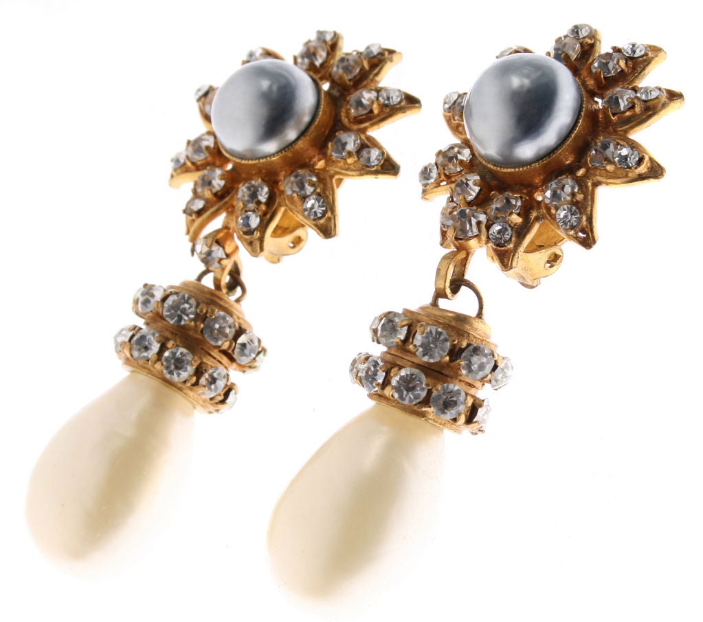 These beautiful CHANEL earrings are sophisticated and elegant featuring a grey faux pearl accented by rhinestones.