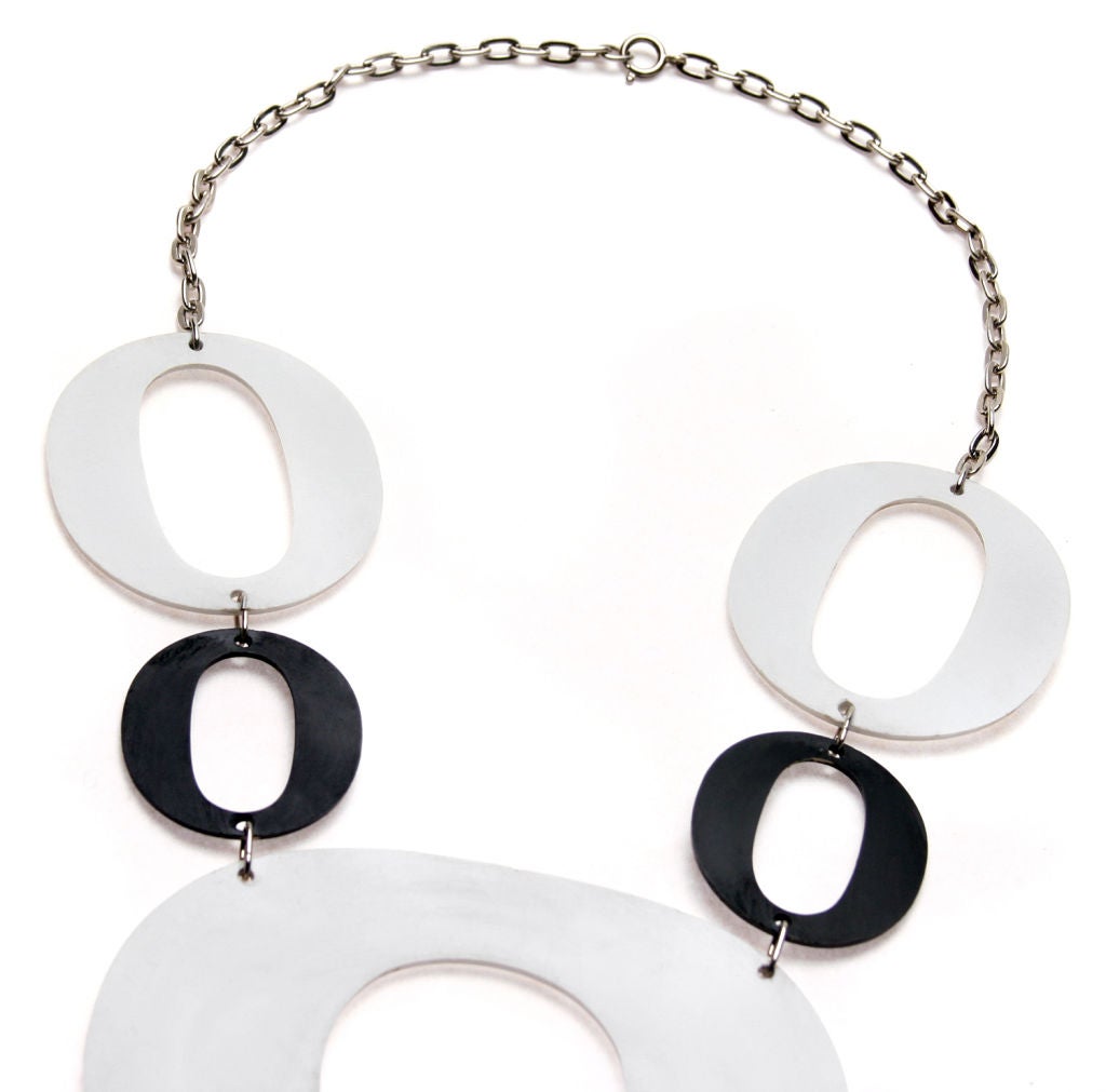 This is a great runway necklace. The measurements are as follows: neck opening 18 inches plus,
total necklace length with hanging pendent 19 inches 
the pendent is 4.25 inches wide and  10.25 inches in legnth.