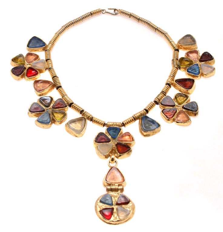 This is a rare piece from Gossens for CHANEL. The fabulous poured glass floriform elements have a Byzantine feel to them.
The necklace is 16
