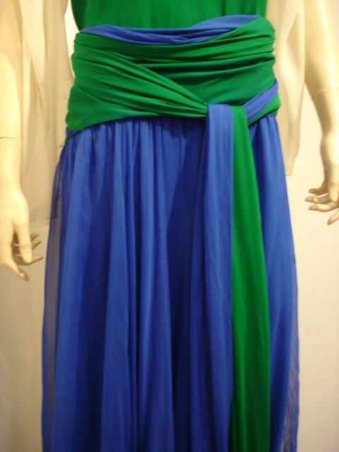 Three tone chiffon evening gown with dramatic self tie dramatic belt, split sleeves and button back. Comes with two chiffon scarves.